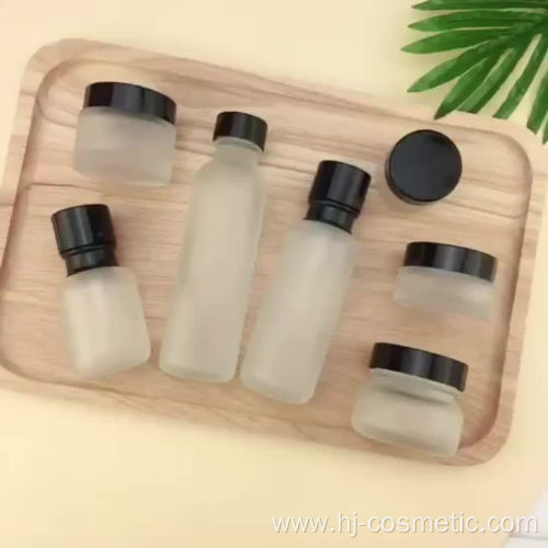 Wholesale Cosmetic Frosted glass bottle with black caps, frosted glass bottles/jars